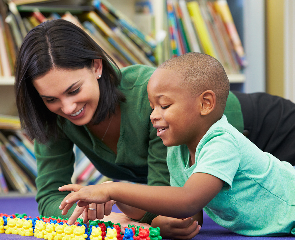 social care worker counting with a child